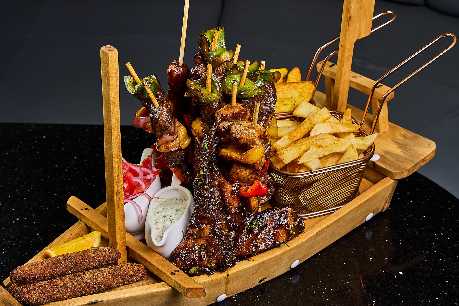 The Villa mega platter of grilled meats and sides