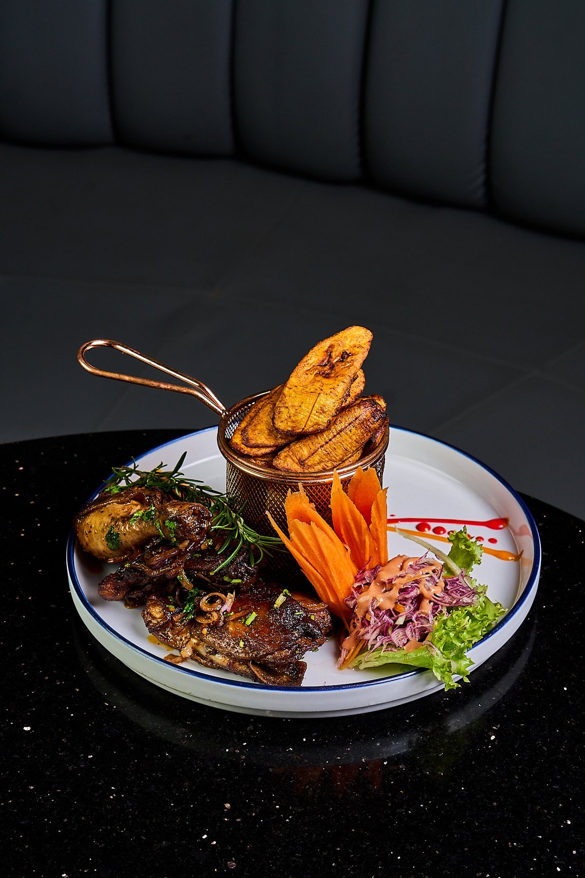 Caribbean jerk chicken plated at The Villa