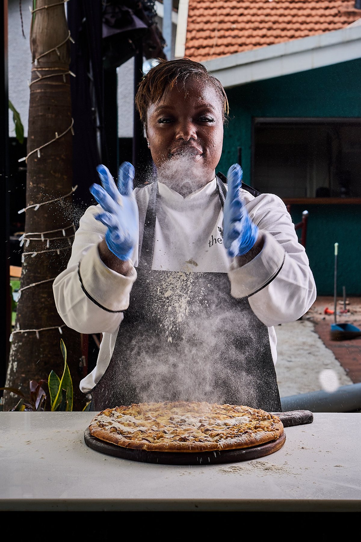 Villa chef presenting a fresh pizza